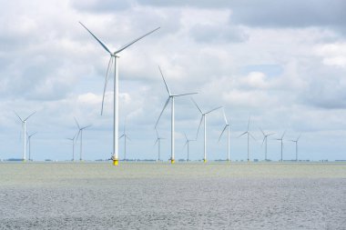 Offshore wind farm on a cloudy day.  IJsselmeer, Netherlands.