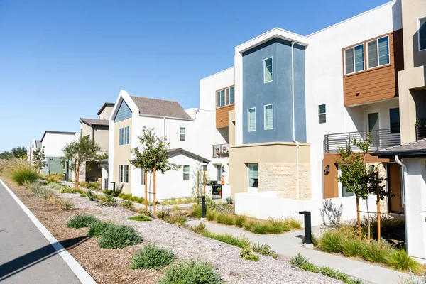 New modern terraced houses in a housing development in California on a clear fall day. Santa Clarita, CA, USA.
