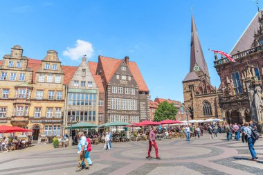Bremen, Germany - June 21, 2022: tourists and locals enjoying a sunny summer day in market square