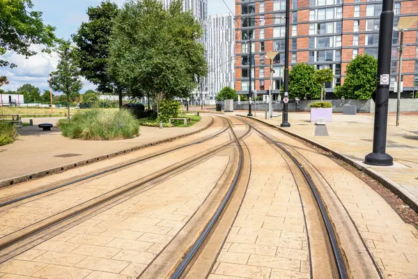 stock image Empty tramway in a suburban residential district on a sunny summer day. Manchester, England, UK.