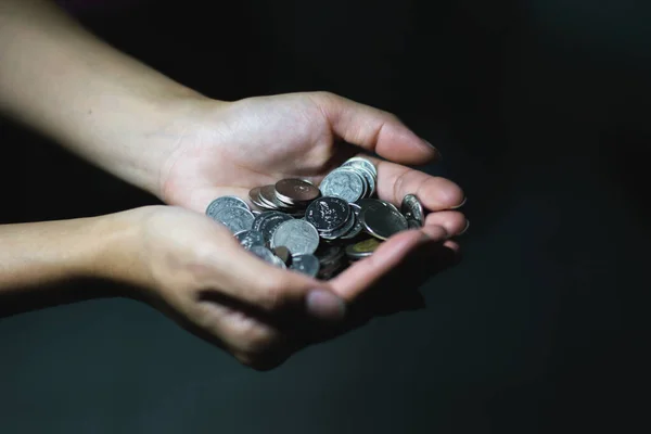 stock image woman 's hand holding coins