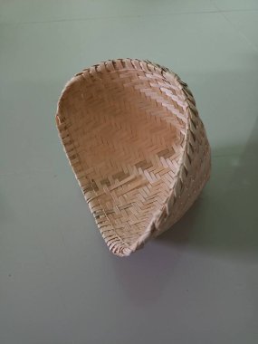 empty basket of straw isolated on white background