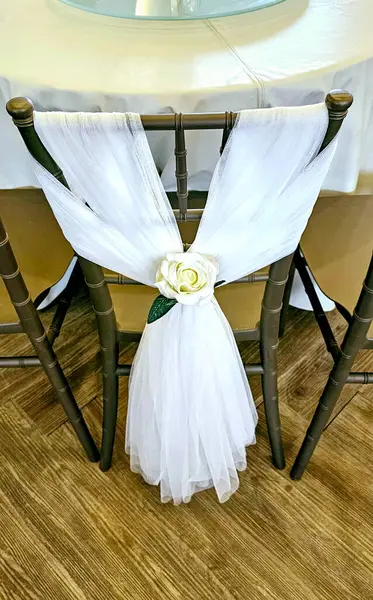 Wedding dress on the chair in the restaurant. Wedding decoration