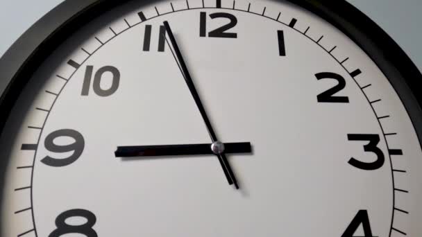 Closeup White Clock Face White Wall Clock Arrows Show High — Stock Video