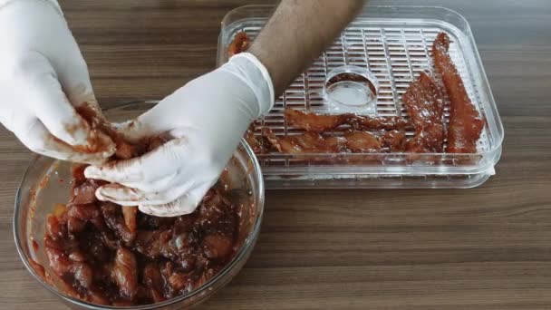 Mens Hands Gloves Cooking Chiken Slices Being Smoked While Dehydrating — Stock Video