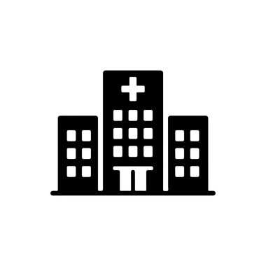 Üzerinde beyaz artı işareti olan bir hastane binasının siyah silueti beyaz arka planda iki kısa bina tarafından çevrelenmiş. 156 karakter.