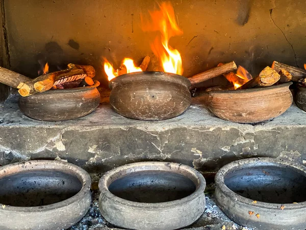 stock image Roasting furnace using a pot and firewood