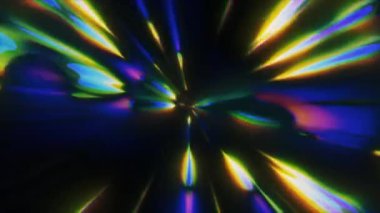 Parlak bir merkeze doğru yaklaşan çok renkli ışık çizgilerinin dinamik ve canlı görüntülerinin canlandırılması hareket ve hız hissi yaratıyor.
