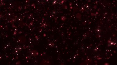 Siyah bir arkaplanda hareket eden soyut titreşen parçacıkların animasyonu. Kırmızı parlak parçacıklar odaklanıyor. Romantik ve aşk teması