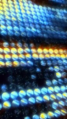 Bir dizi mavi ve sarı daire desenleri gösterilir ve ilginç bir soyut tasarım oluşturulur. Telefonlar için dikey duvar kağıtları.