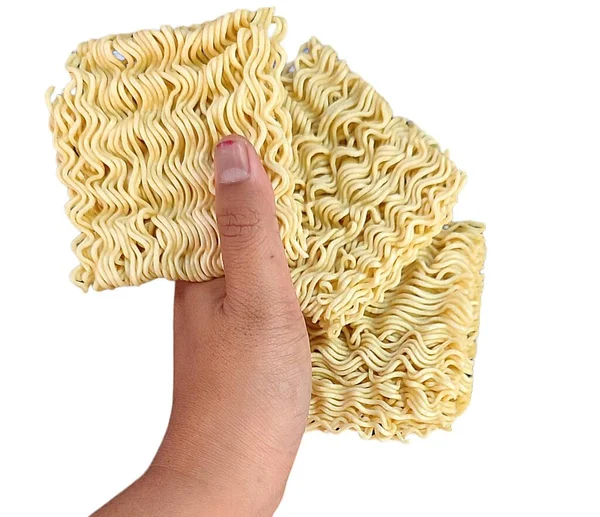 Hand Holding Spaghetti Noodles — Stock Photo, Image