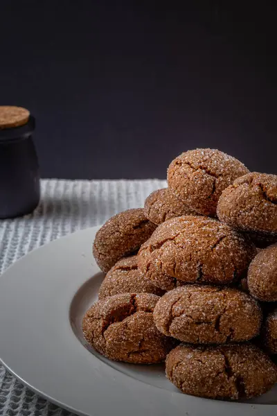 Warm Homemade Gingersnap Cookies on a dark background. high quality photo