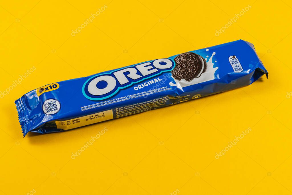 Lviv Ukraine 04.02.25 A package of original Oreo cookies sits on a vibrant yellow surface. The blue wrapper prominently displays the Oreo logo and product details.
