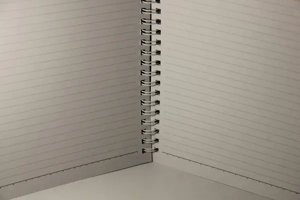 open blank book with spiral ring binding