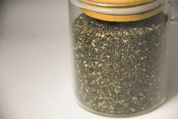 Basil seeds stored in a clear jar are good for dieting