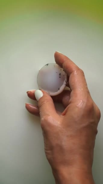 Girl Takes Agate Stone Out Milky Liquid Hold Her Fingers — Stock Video