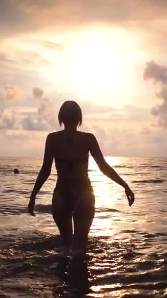 Young Woman Swimsuit Walks Sea Golden Hour Sunset Slow Motion — Stock Video