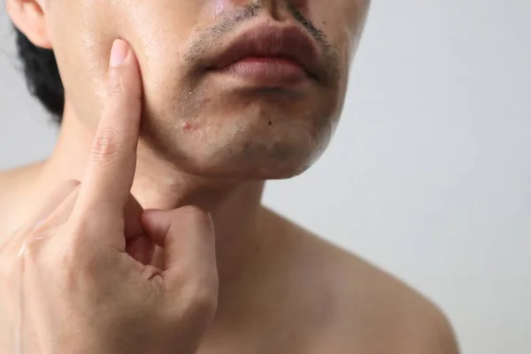 Close up of men doing skin care
