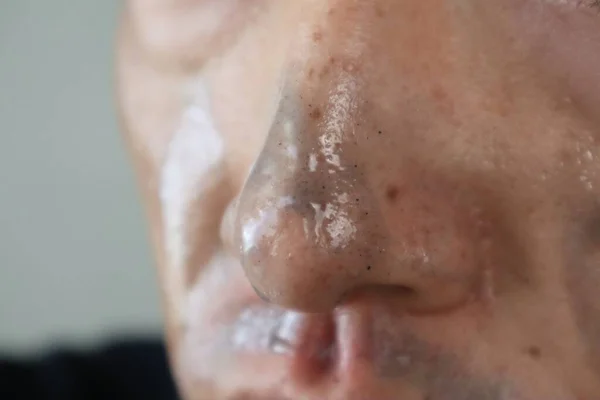 Close-up of a man doing skin care