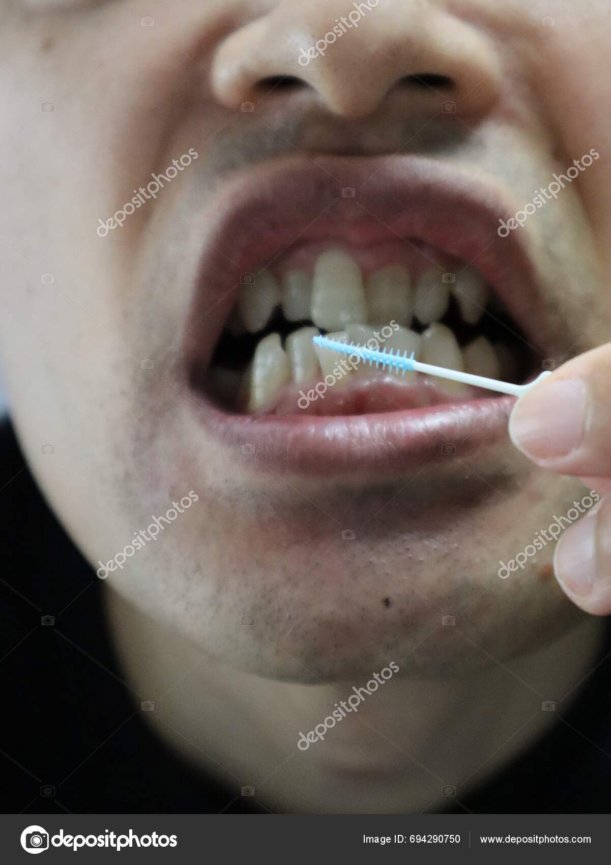 Person Cleaning Gaps Teeth Interdental Brush Stock Photo by ©masamasa3