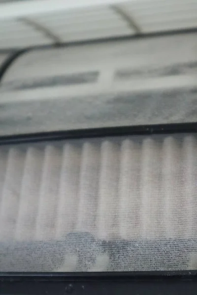 Close-up of dirty air conditioner interior