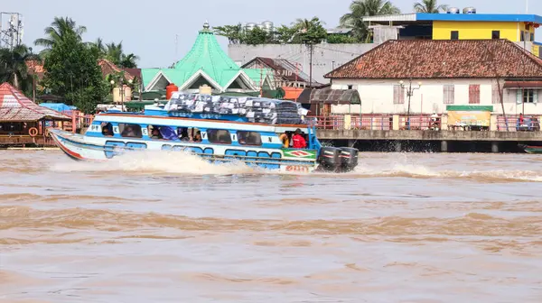 stock image  boats as a means of public transportation on the MUSI river. famous river in the city of Palembang, South Sumatra, Indonesia.