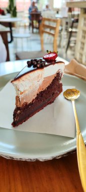 Freshly prepared delicious chocolate cake with strawberries on the table in the cake stand clipart