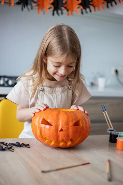 Kid Looking Carved Pumpkin While Preparing Halloween Decor — Stock Photo, Image