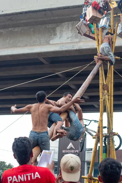 Stock image Indonesian Independence Day Climbing Pinang Competition in Kalimalang, East Jakarta.