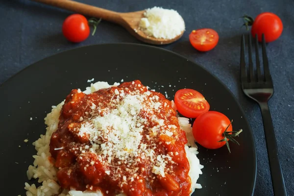 Rice Tomato Sauce Meatballs Parmesan Black Plate Next Fork Cherry — Stock Photo, Image