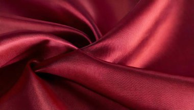 İpek satenden yapılmış lüks, parlak, pürüzsüz bir kumaşın soyut görüntüsü