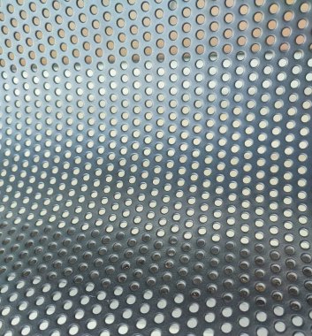 Perforated black metal panel background. White metal plate with dots. Aluminum punching metal clipart