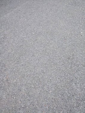 asfalt pürüzlü ve kayalık grunge yüzeyi, doku arka planı, gri asfalt yol