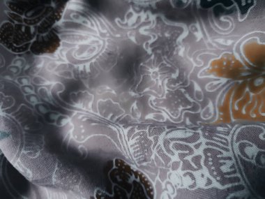 Çiçekli süslemeleri olan renkli tekstil desenleri arkaplan olarak kullanışlıdır