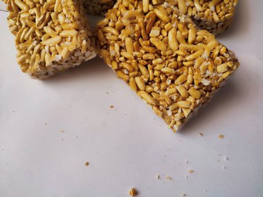 Traditional Indonesian snack called berondong or jipang or popcorn made from rice, corn coated with sweet caramel clipart