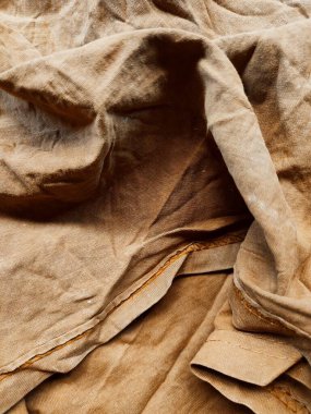 the texture and background of the brown cloth is damaged and dirty clipart