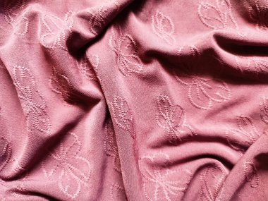 Çiçek motifli pembe kumaşın dokusu ve arka planı