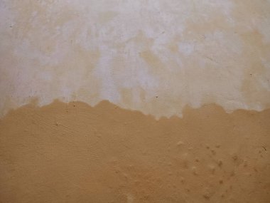 desen, desen, pürüzlü ve düzensiz sarı duvar arkaplanı, canlı ve soyut bir arkaplan oluşturur.