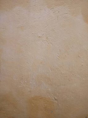 desen, desen, pürüzlü ve düzensiz sarı duvar arkaplanı, canlı ve soyut bir arkaplan oluşturur.