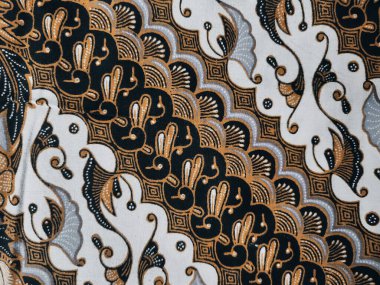 Cava Batik 'te yaygın olarak bulunan motifleri içeren bir arka plan modeli. Şablon simetrik ve soyut olup kumaş, giysi, sanat eseri veya ambalaj kağıdı tasarımlarında kullanılabilir..