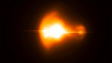 Büyüleyici bir 3 boyutlu animasyon. Sarı ışık kabarcıkları ve parlak çizgiler var. Büyüleyici bir siyah arka planda geçiyor..