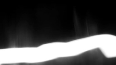 Büyüleyici bir 3 boyutlu animasyon. Beyaz ışık kabarcıkları ve parlak çizgiler var. Büyüleyici bir siyah arka planda geçiyor..