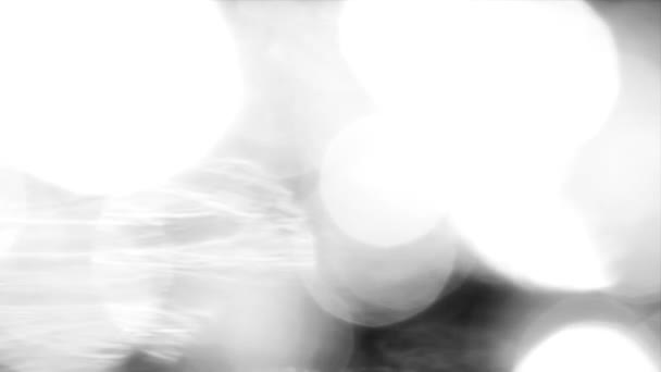 白い光の泡と活気に満ちたストライプを特徴とする魅惑的な3Dアニメーション 魅惑的な黒の背景に設定 — ストック動画