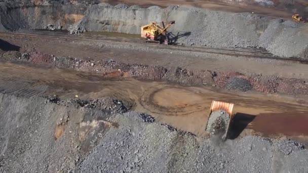 Big Yellow Truck Pours Metal Ore Body Quarry Aerial Top — Stock Video