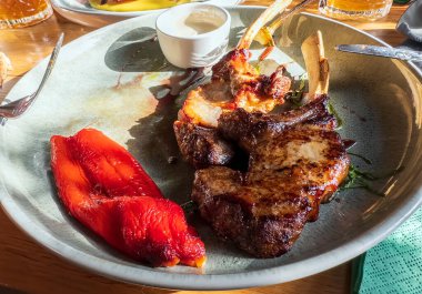 Rack of lamb with grilled vegetables on a plate close up. High quality photo