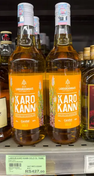 Grand Bay, Mauritius - 29 Ocak 2025: Labourdonnais Karo Kann Gold Rum Cordial Bottles with Price Tag. Yüksek kalite fotoğraf
