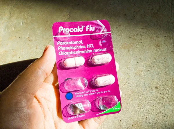 stock image West Sumatra, Indonesia - August 27, 2023 : Procold flu is a medicine used to relieve flu symptoms, such as fever, headache, runny or stuffy nose, sneezing, and dry cough.