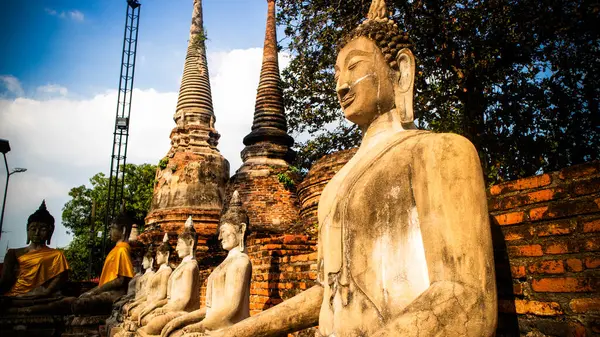 Row of ruined statue of buddha at Wat Yai Chaimongkol,Wat Yai Chai Mongkhon, Ayuthaya, Thailand,Asia