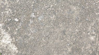 Doğal desenlere sahip kaba gri beton dokunun yakın çekimi, arka plan, duvar dokusu veya inşaat malzemesi tasarımı için ideal