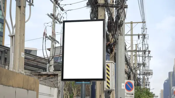 Blank billboard on the road in Thailand Blank billboard with copy space for text or content. Simulate an empty billboard in a big city.